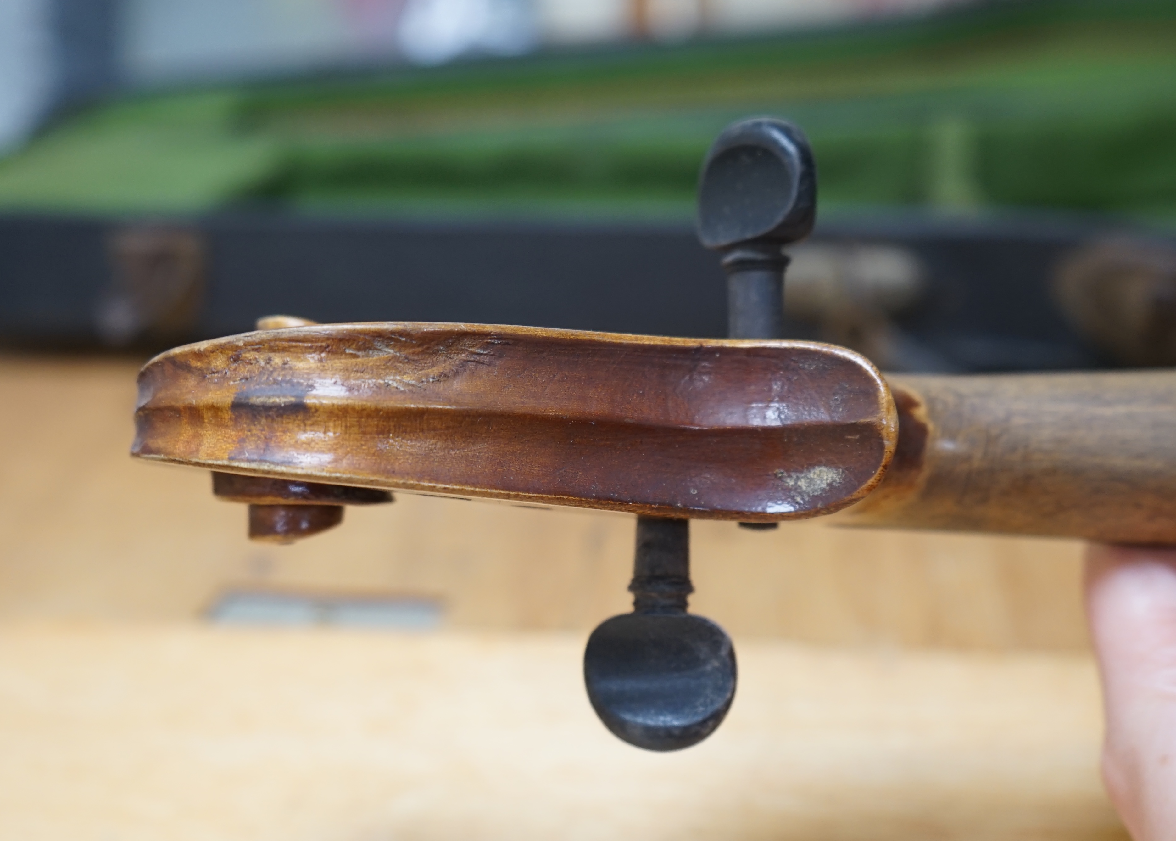Early 20th century ¾ size violin, unlabelled, cased, together with a violin table, back and scroll. Condition - fair